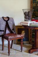 Antique chair, desk with books and oil painting