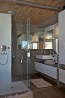 Designer bathroom with shower area in rustic woode