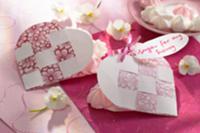 Heart-shaped cards filled with meringue dots for a