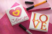 Small, home made pictures the word 'love' written 