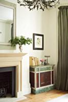 Corner of grand living room with antique cabinet n