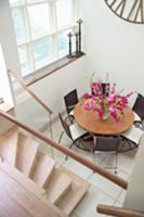 Dining area on white tiled floor in modern anteroo