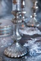 Silver candlesticks on festive table