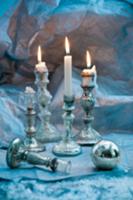 Antique silver candlesticks and Christmas bauble