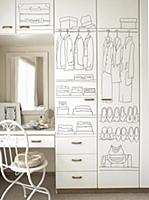 White, painted wardrobe next to a dressing table a