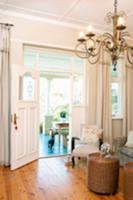 Chandelier in a traditional salon and view through