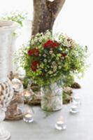 Summery flower bouquet and tea lights