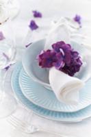 A place setting decorated with hydrangea