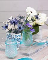 Centrepiece with gerberas, roses, violas and sea-h