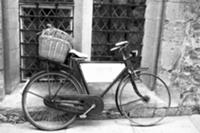 Old bicycle in front of house