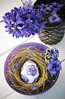 Easter egg decorated with purple napkin decoupage 