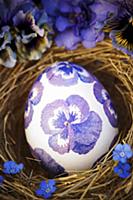 Easter egg decorated with purple, napkin decoupage