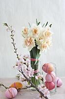 Easter arrangement of dyed eggs, narcissus & sprig