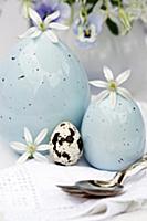 Easter table decoration with china eggs, quail's e