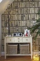 Cream-painted console table against photo mural wi