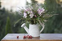 Autumn bouquet of heather, ivy and pink lilies in 