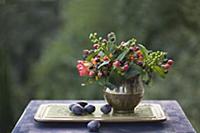 Autumn still-life arrangement with posy of berries