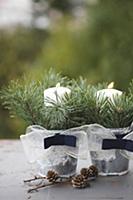 Two zinc buckets decorated with ribbon, spruce twi