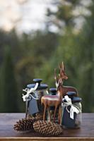 Autumn arrangement of storage jars with black lids