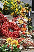 Wreath of rosehips and natural craft utensils on a