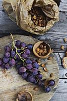 Black grapes and apricot stones