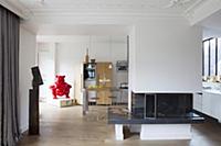 Open fireplace used as partition between living ro