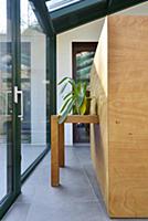 Houseplant on table integrated into wooden block i