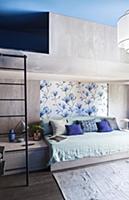 Modern, concrete bunk beds in blue and grey bedroo