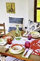 Table set with colourful crockery