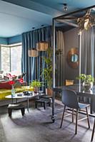 Open-plan interior in dark bold colours