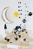 Space party: table festively set for child's birth