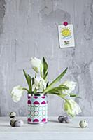 White tulips in can covered with fabric