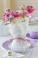 Woman's name on wrapped ranunculus bouquet with pi