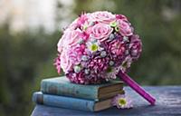 Romantic, pink bridal bouquet arranged with blue, 