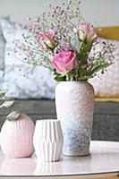 Roses and pink gypsophila in mottled vase