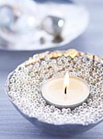 Tealight in bowl filled with silver beads