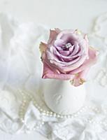 Romantic wedding decoration: ring nestled in a ros