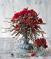 Bouquet of red begonias, orchids and rowan berries