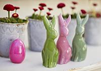 Easter-bunny candles decorating table