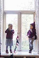 Two girls wearing sustainable fashion stood in per