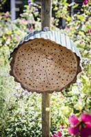 DIY insect hotel with metal roof