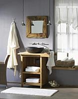 Rustic bathroom with stone sink on wooden table