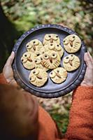 Owl-shaped biscuits on black plate