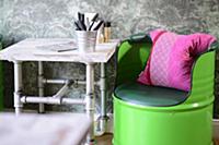 Green-painted barrel chair and vintage-style table