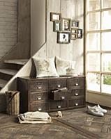 Industrial-style chest of drawers against side of 