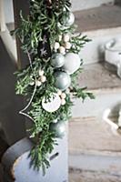 Garland of juniper branches, wooden beads and baub