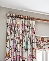 Brightly patterned curtain draped in elegant folds