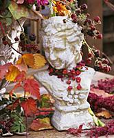 Bust decorated with spindle fruits, blackberries &