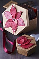 Colourful autumn leaves stuck on gift boxes