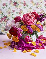 Colourful bouquet of peonies, roses and sunflowers